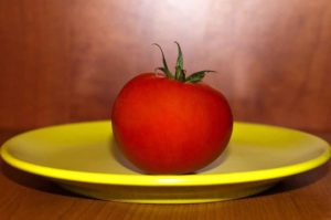 A full tomato on a plate